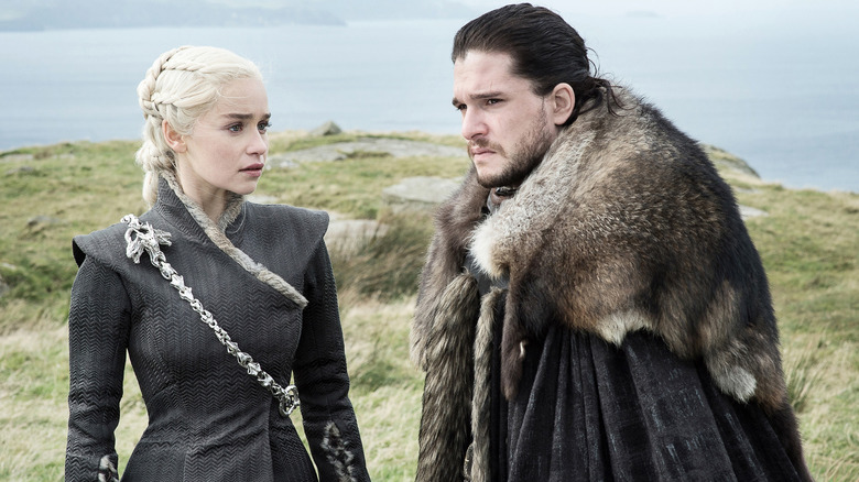 Daenerys Targaryen stands next to John Snow outside