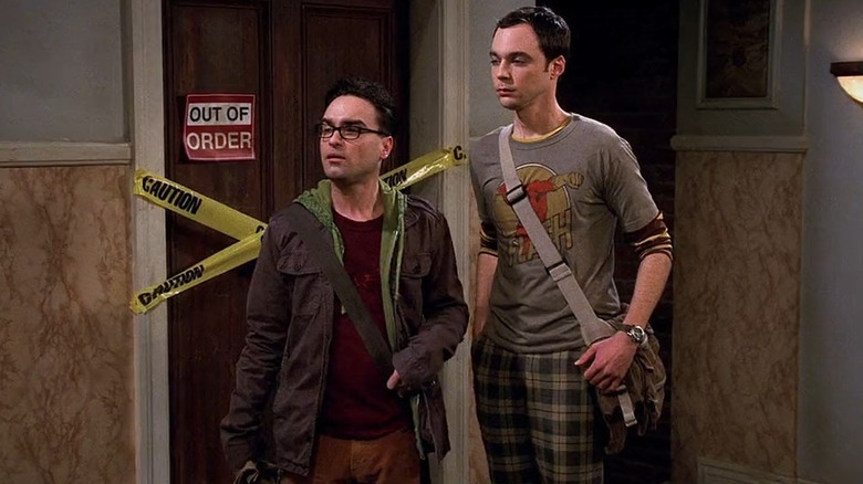 Leonard and Sheldon stand together in their apartment building hallway