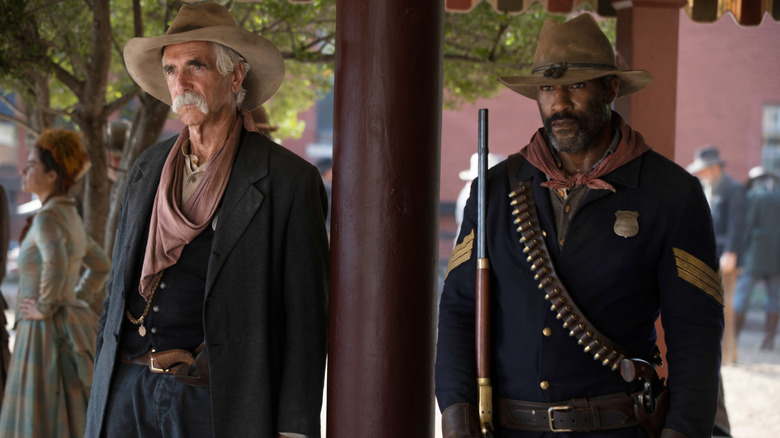 Sam Elliott and LaMonica Garrett standing together