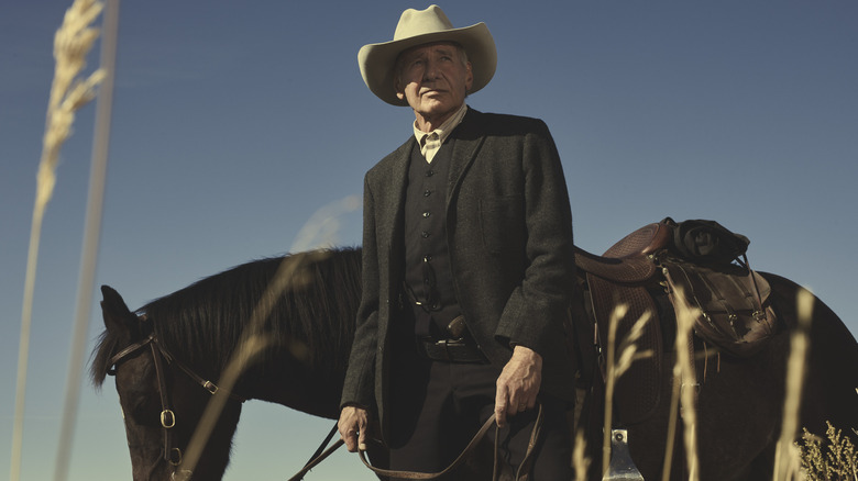 Harrison Ford as Jacob Dutton in front of horse in 1923