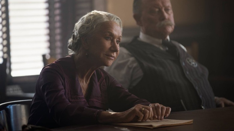 Cara Dutton at a desk