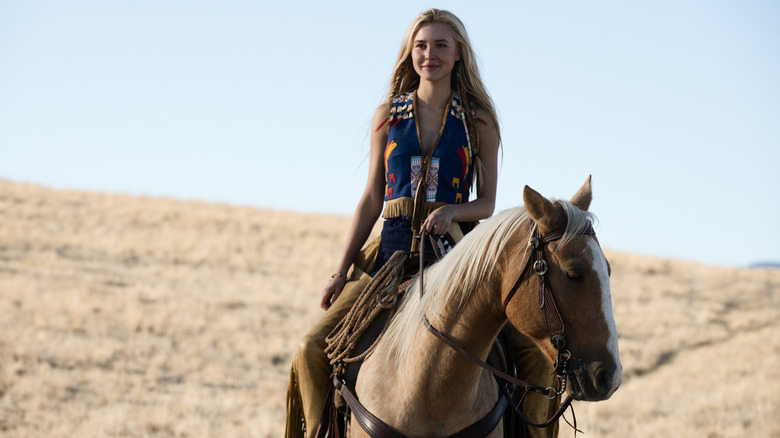 Isabel May as Elsa Dutton riding a horse in 1883