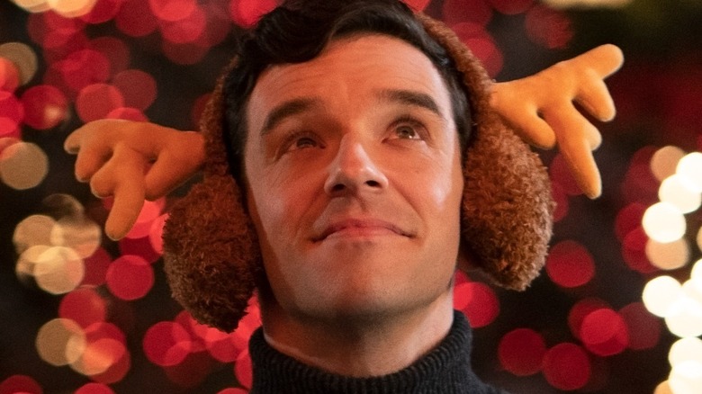 Peter wearing reindeer ear muffs