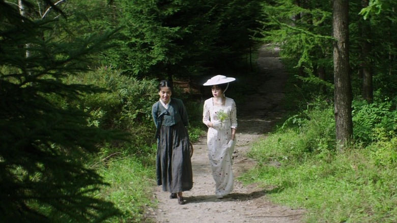 Sook-hee and Hideko walking outside