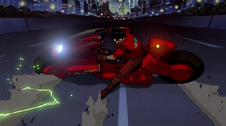 Kaneda slides on his motorcycle in Akira