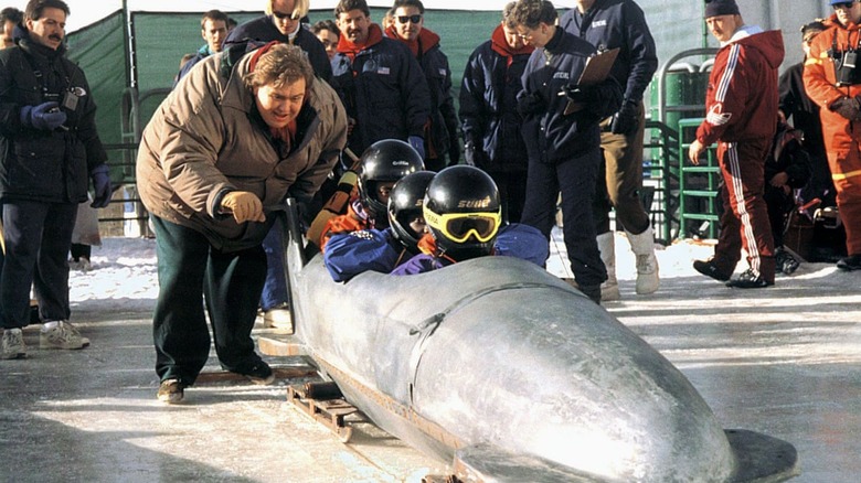 Herb Blitzer pushing Jamaican bobsleigh team