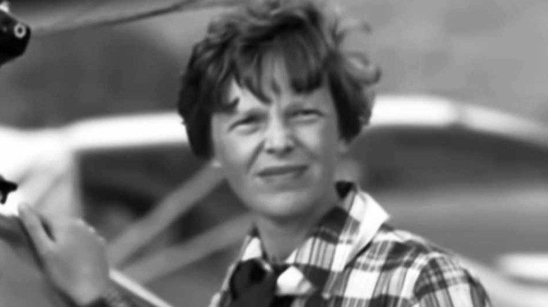 Amelia Earhart winces