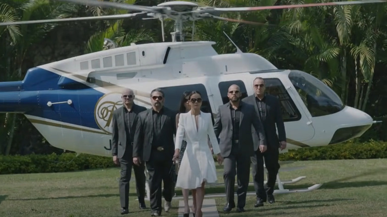 Teresa walking off helicopter in Queen of the South