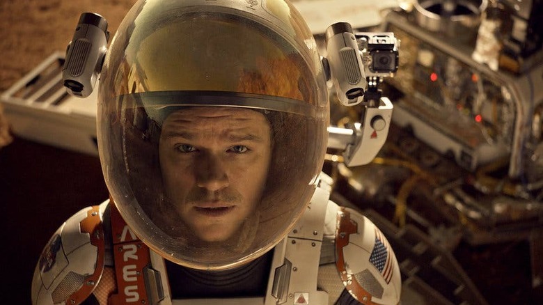 Matt Damon fixes a robot in The Martian