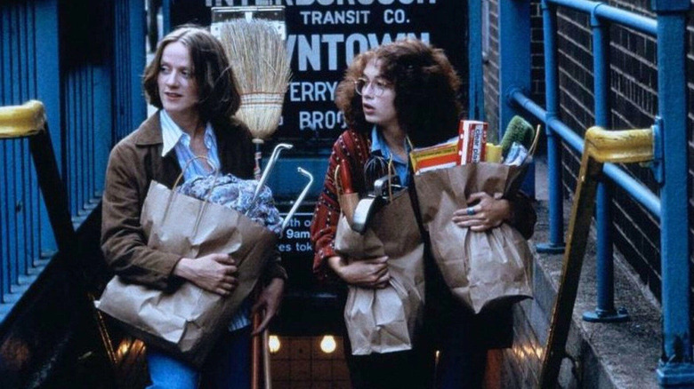 Anita Skinner and Melanie Mayron carry bags