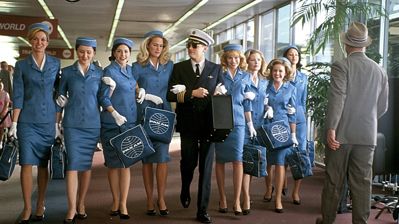 Frank Abagnale walking with stewardesses