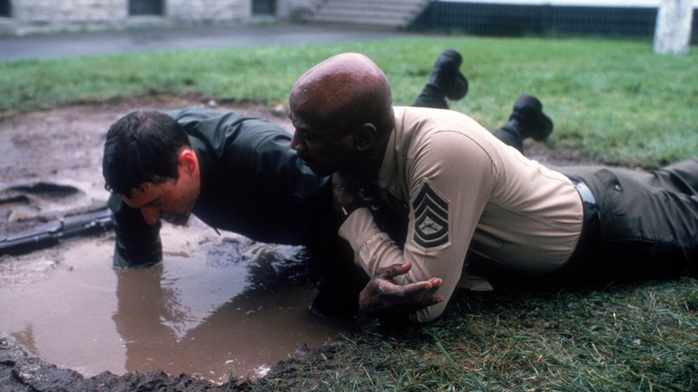 Zack and Sgt. Foley doing push ups in the mud