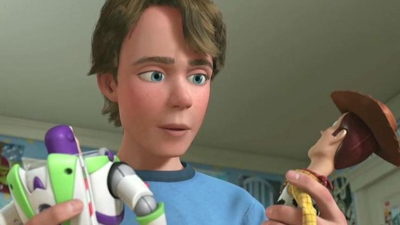 Andy grown up holding toys Toy Story