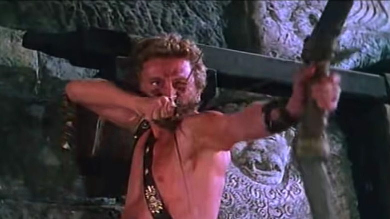 Kirk Douglas with a bow and arrow 