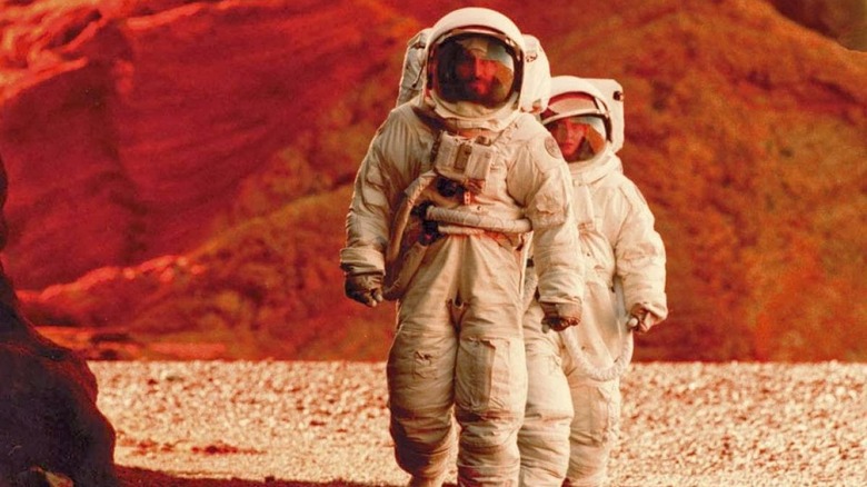 Two astronauts walk on Mars