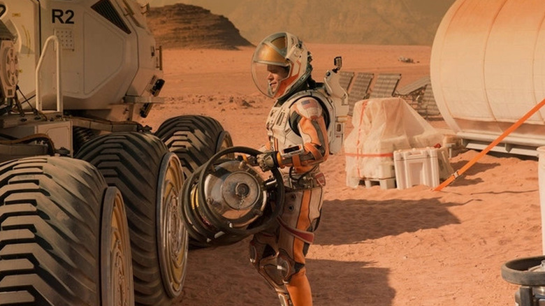 Watney loads a Martian rover