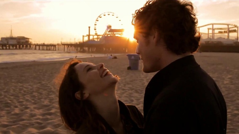 Jacob and Anna laughing on the beach