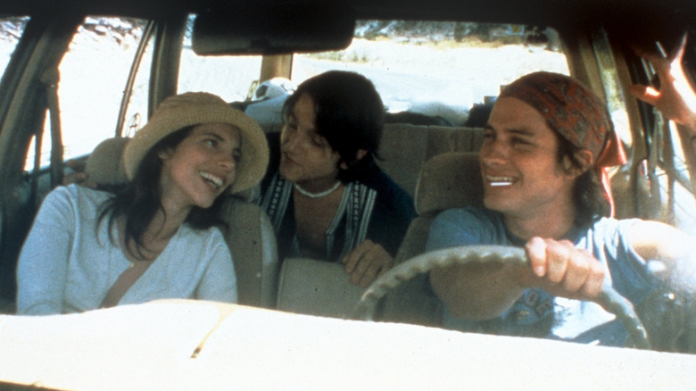 Luisa, Tenoch and Julio smiling in the car 