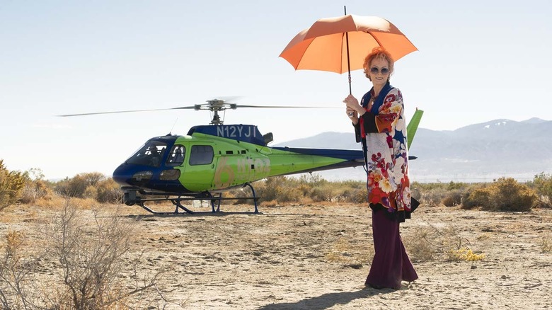 Deborah Vance stands by a helicopter