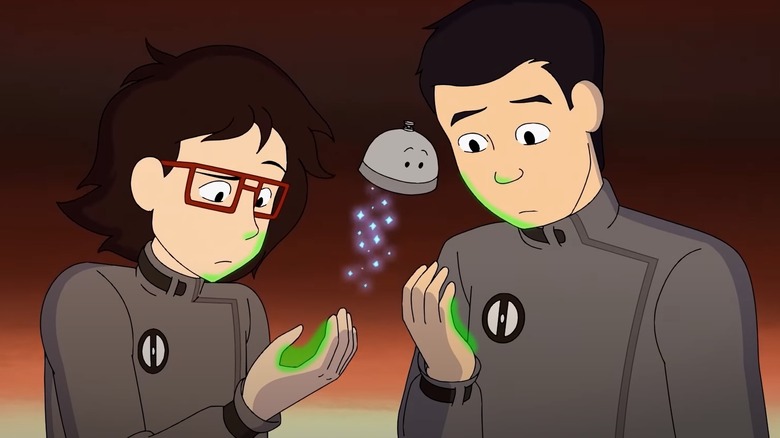 Min-gi and Ryan look at their glowing palms Infinity Train