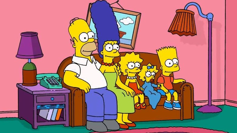 The Simpsons sitting on their couch