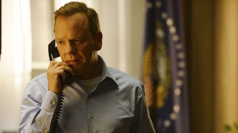 Kiefer Sutherland talks on the phone