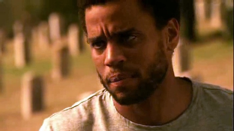 Michael Ealy looks left