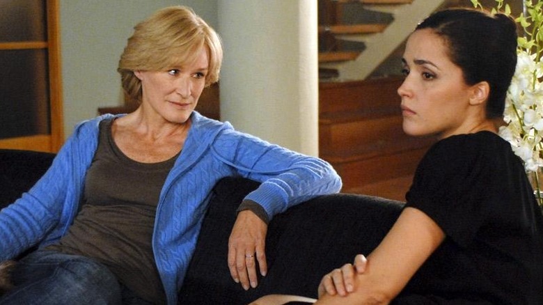 Glenn Close looks at Rose Byrne on the couch