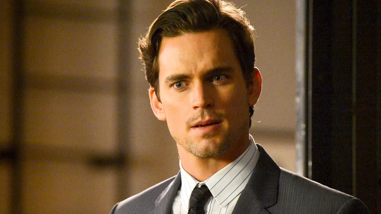 Bomer stands in a doorway