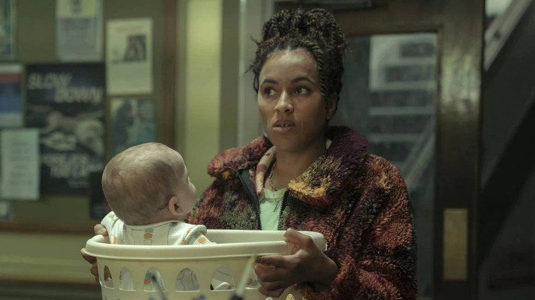 Natasha tries to leave the baby at the police station in a laundry basket