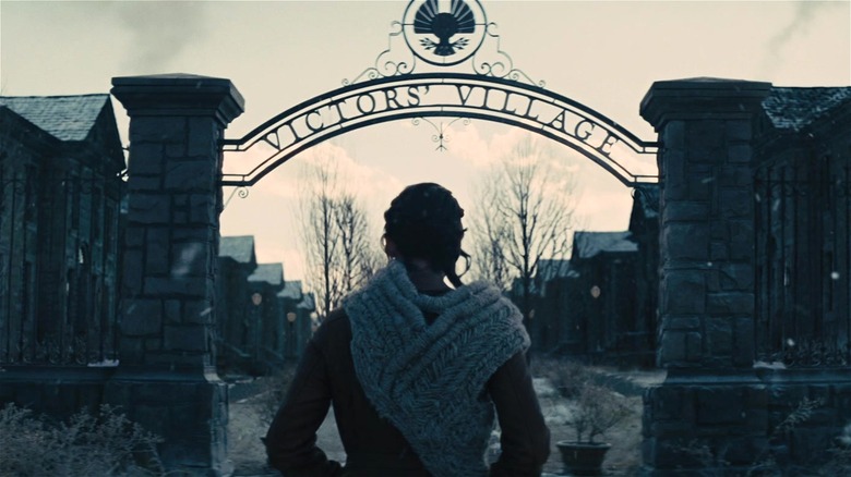 Katniss standing before Victors' Village