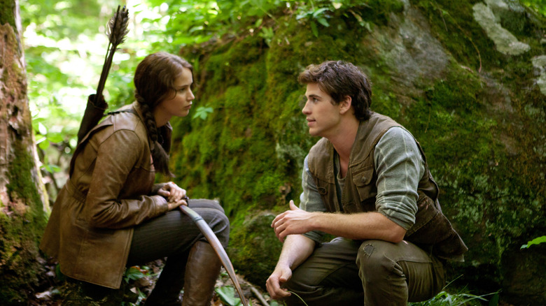 Katniss and Gale talking in forest