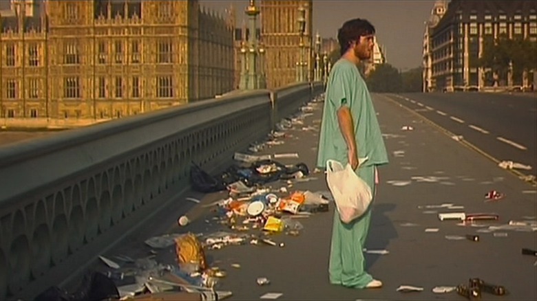 Jim standing outside of empty London