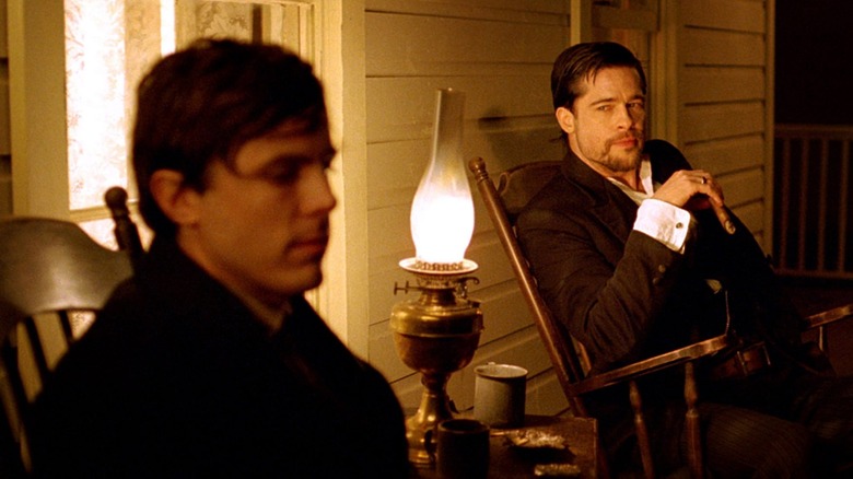 Affleck and Pitt sitting on a porch together