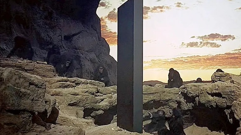 Monolith surrounded by apes