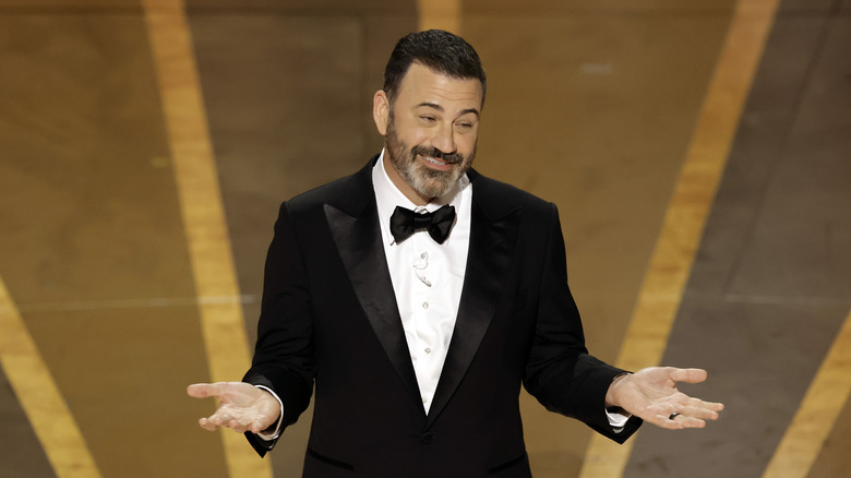 Jimmy Kimmel shrugging Oscar stage