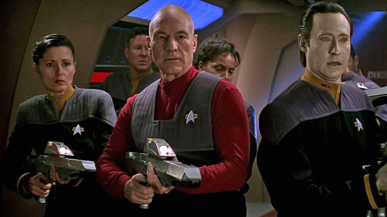 Picard and Data aiming phasers
