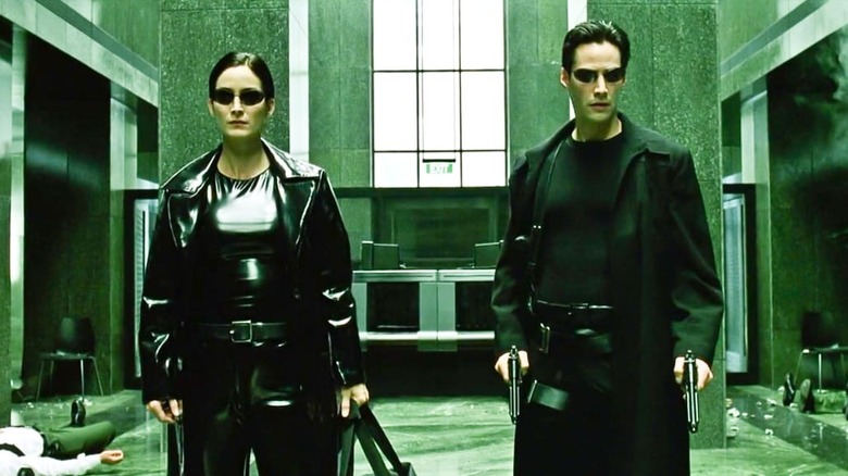 Trinity and Neo preparing for battle