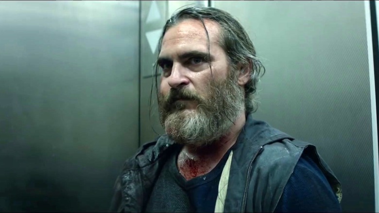 Joaquin Phoenix tense in elevator