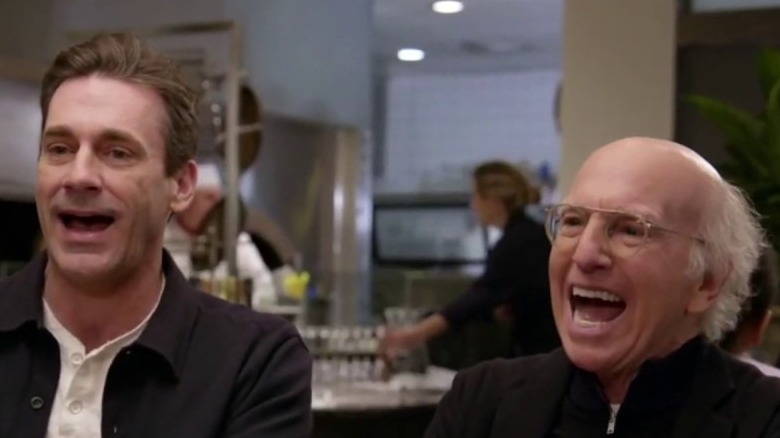 Jon Hamm and Larry David laugh