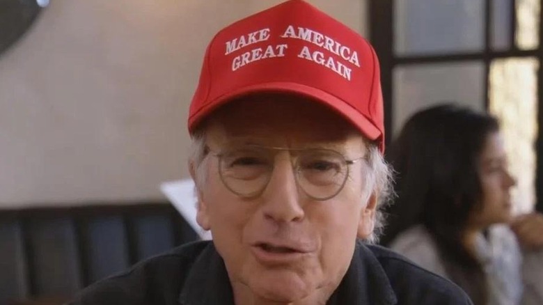 Larry wearing MAGA hat