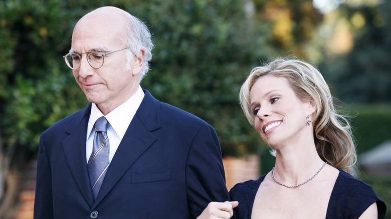 Larry David links arms with Cheryl