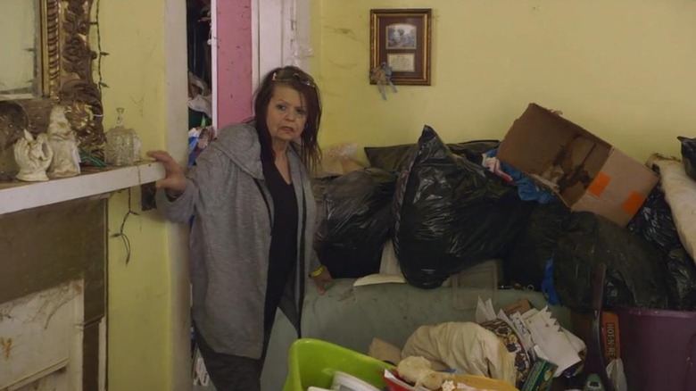 Linda walks through her messy house