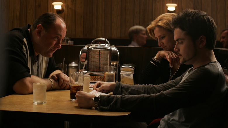 The Sopranos sit in diner booth