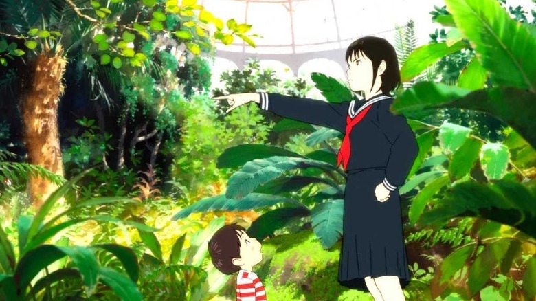 Kun and Mirai standing in greenhouse