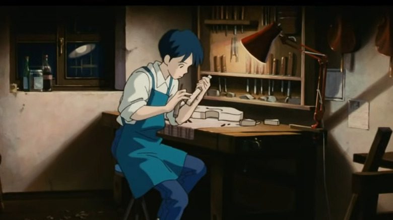 Seiji working on a violin