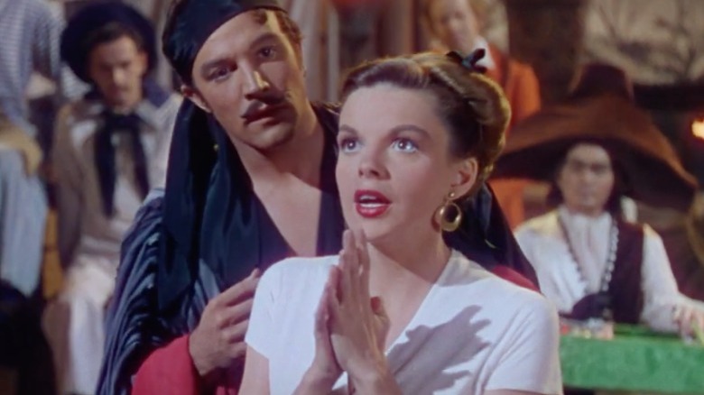 Gene Kelly checks on Judy Garland