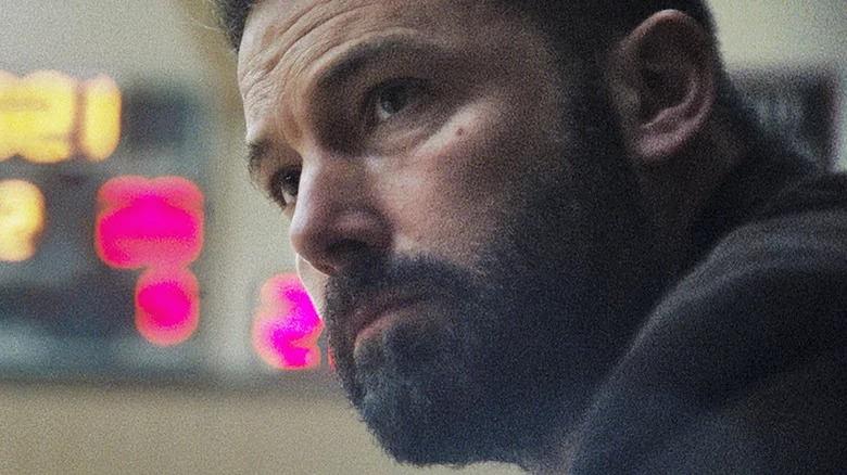 Affleck close-up in front of scoreboard 