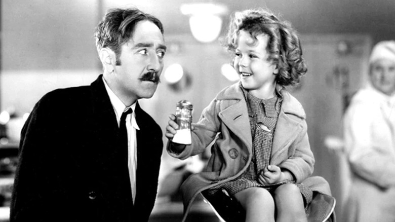 Shirley Temple shakes salt