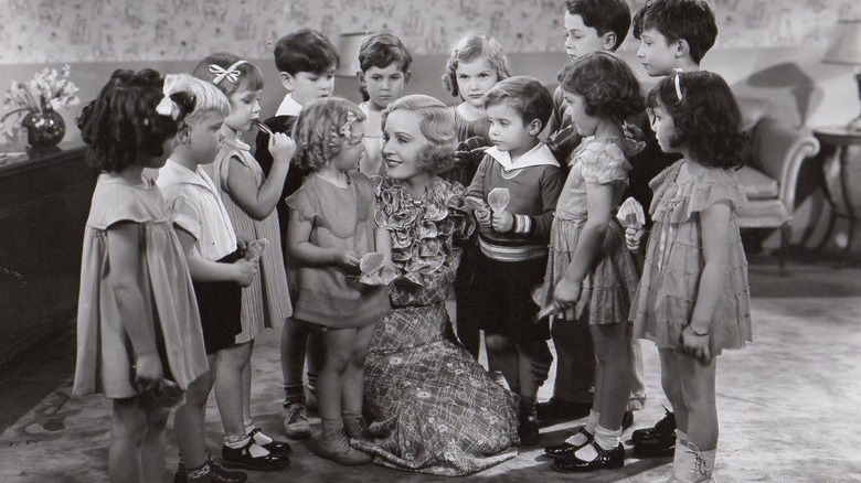 Shirley Temple huddles in group